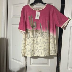 Pink and crème colored top with cactus and Aztec print on front and back